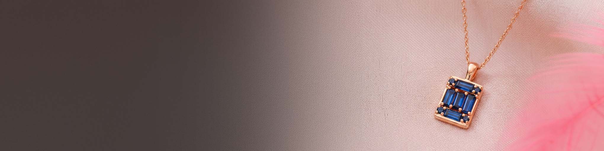 Collar colgante zafiros azules talla baguette engastado garra oro rosa 18 quilates joyería fina lujo