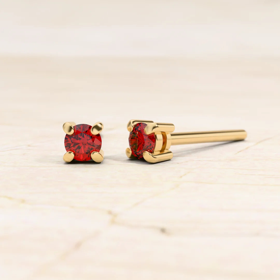 Boucles d'oreilles solitaire rubis en or jaune 18cts