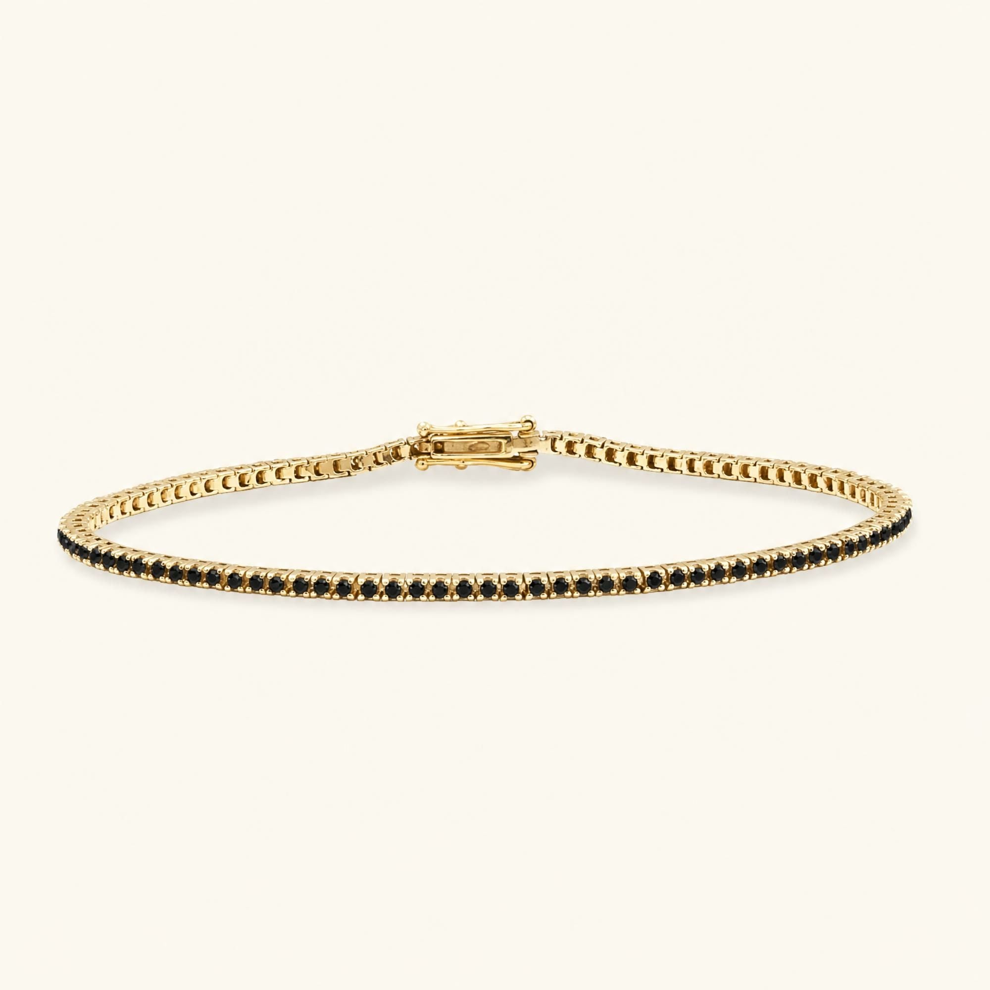 Pulsera tenis Ganga oro amarillo 18 quilates engastada diamantes negros