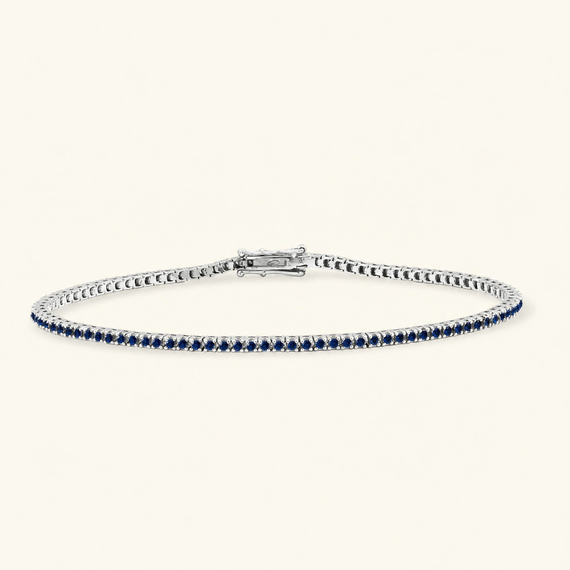 Pulsera de tenis rivière zafiro oro blanco 18 quilates