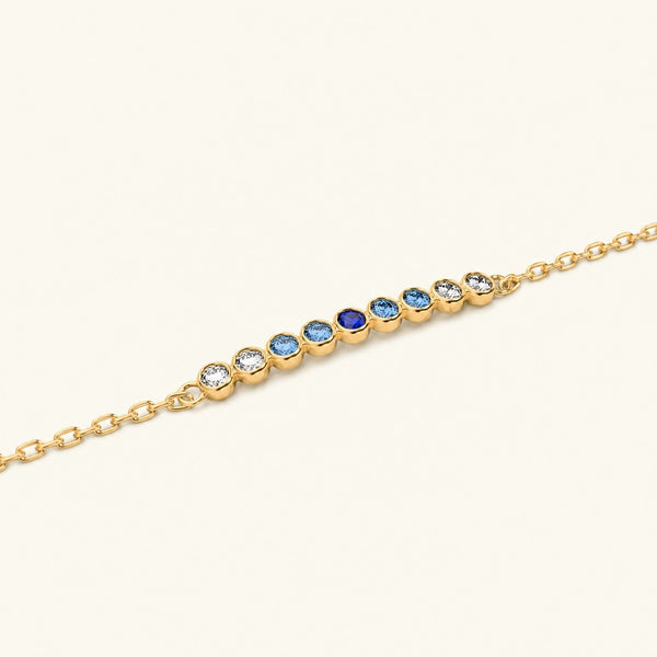 Pulsera Noor de oro amarillo con zafiro horizon