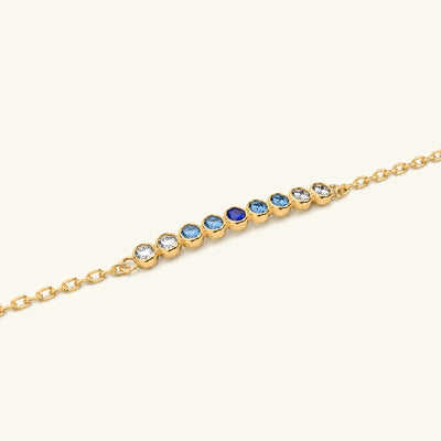 Pulsera Noor de oro amarillo con zafiro horizon
